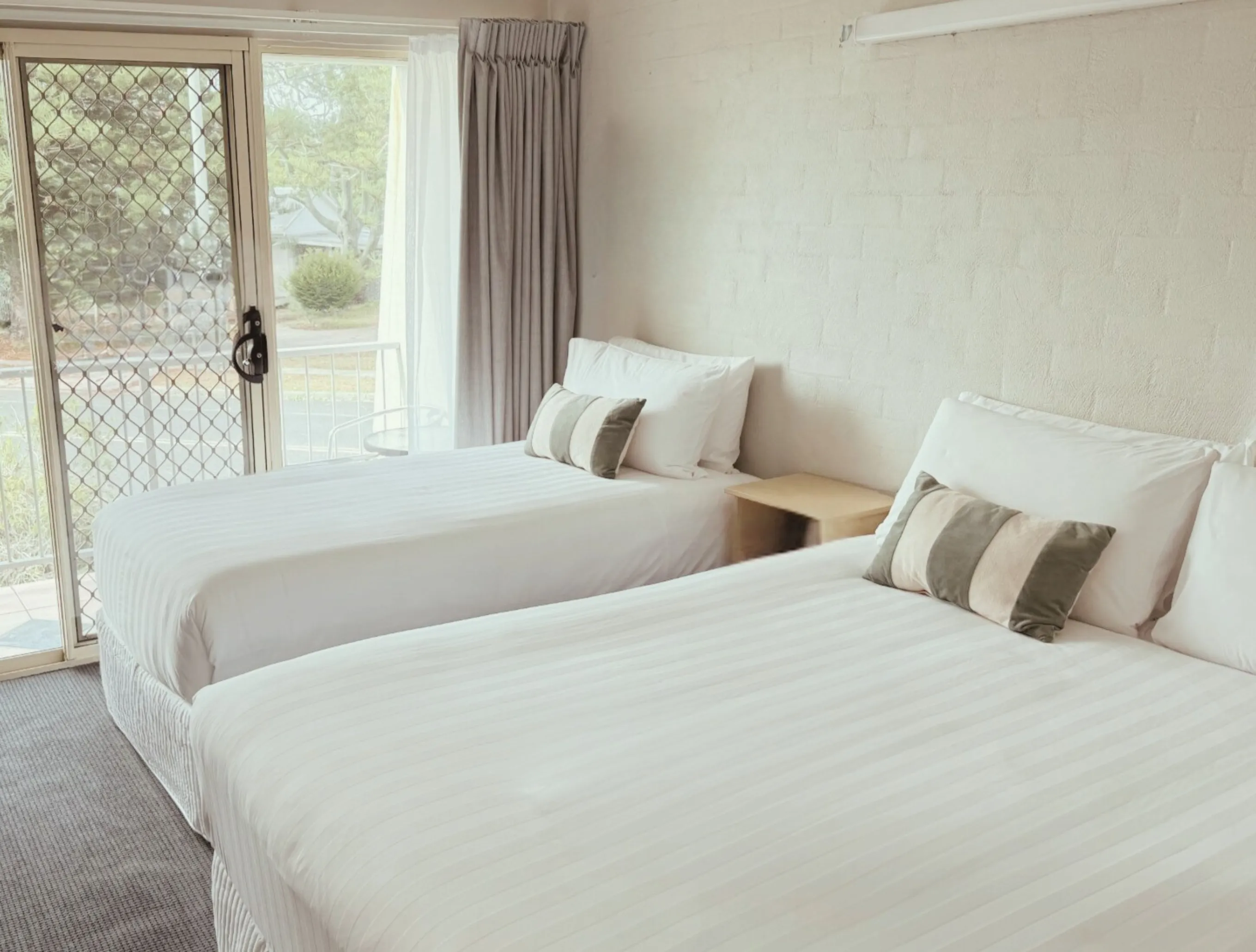 Bright, freshly made twin room at Yamba Sun Motel